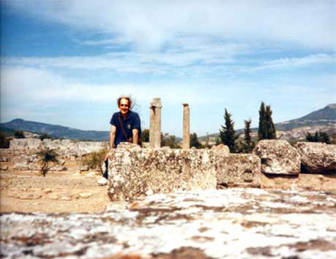Nate sits among the ruins in Nemea, Greece