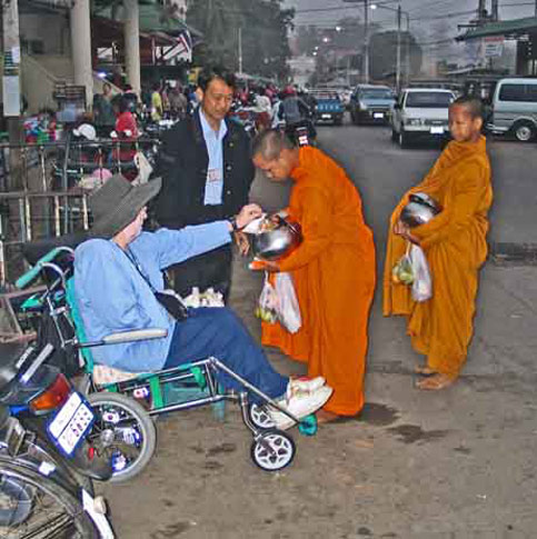 Travel disabled wheelchair see monks in thailand