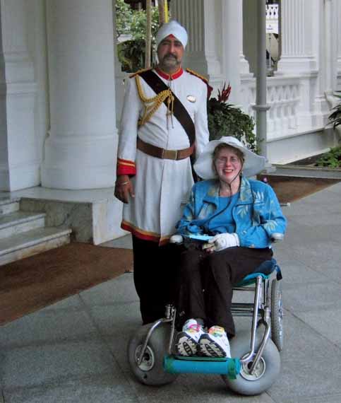 Nancy and Nate travel in wheelchair to Singapore
